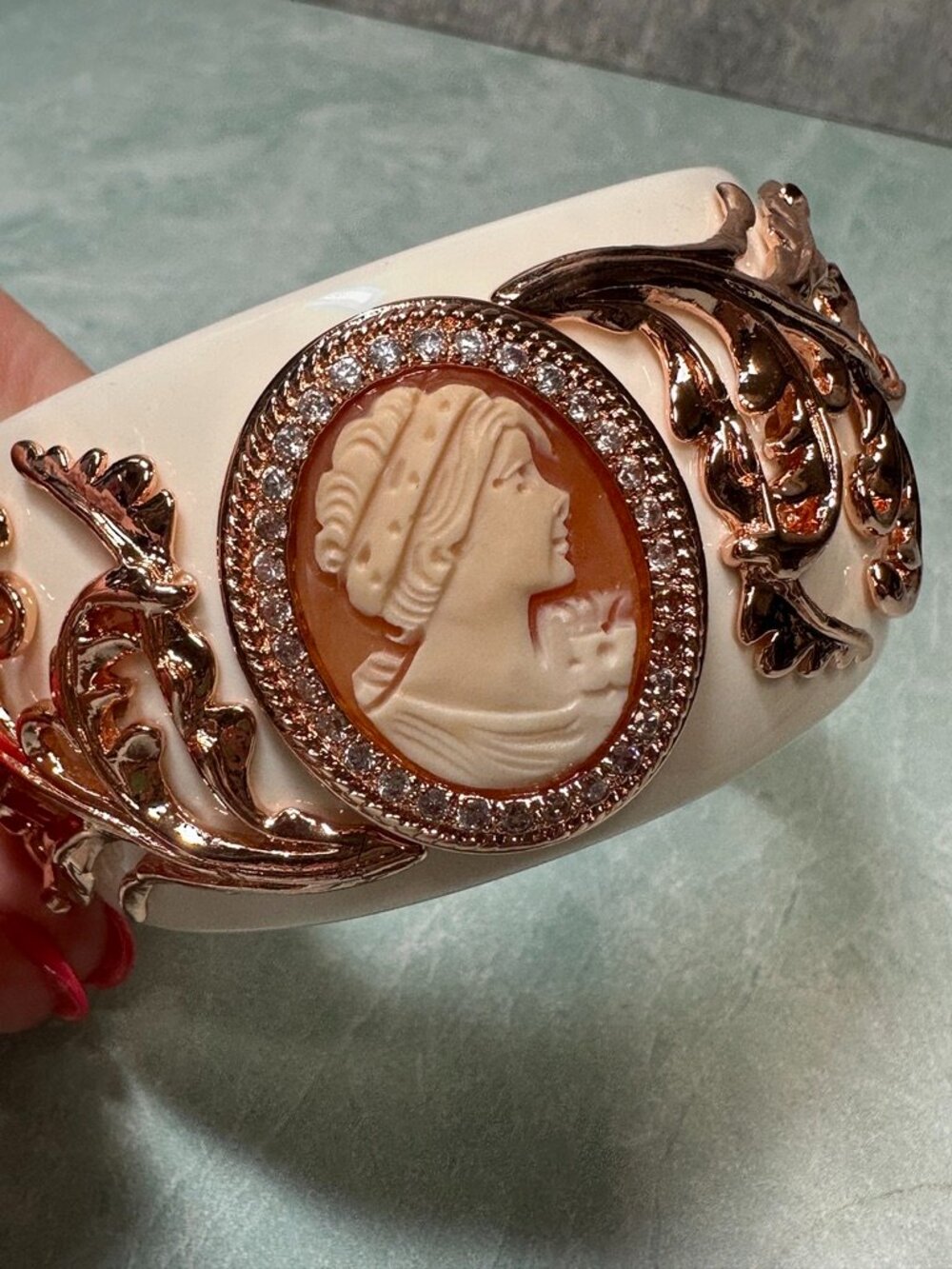 Amedeo white lucitte and rosegold tone chunky bangle bracelet with carved cameo